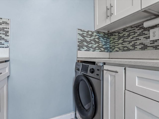 laundry area featuring cabinet space and washer / clothes dryer