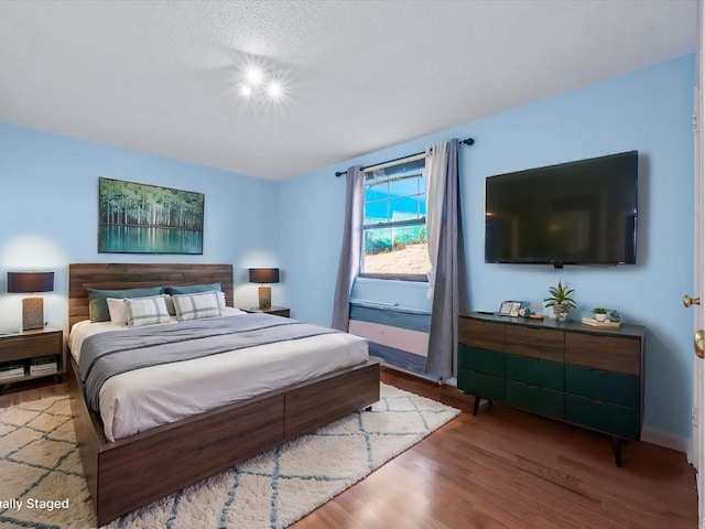 bedroom with wood finished floors