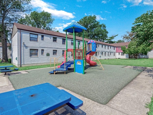 community play area with a lawn