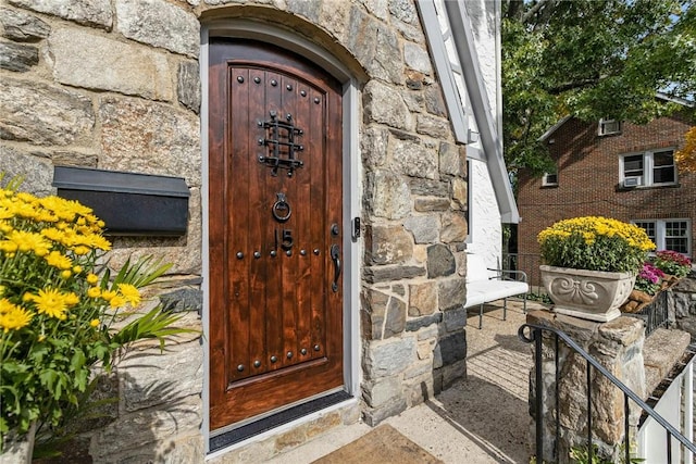 view of exterior entry with stone siding