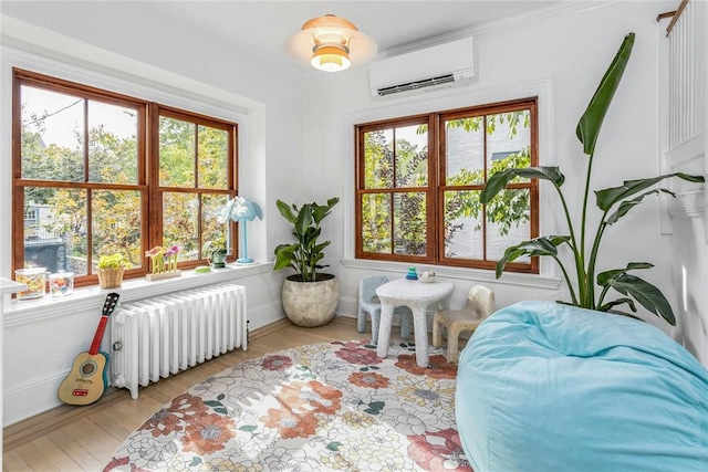 interior space featuring an AC wall unit and radiator heating unit