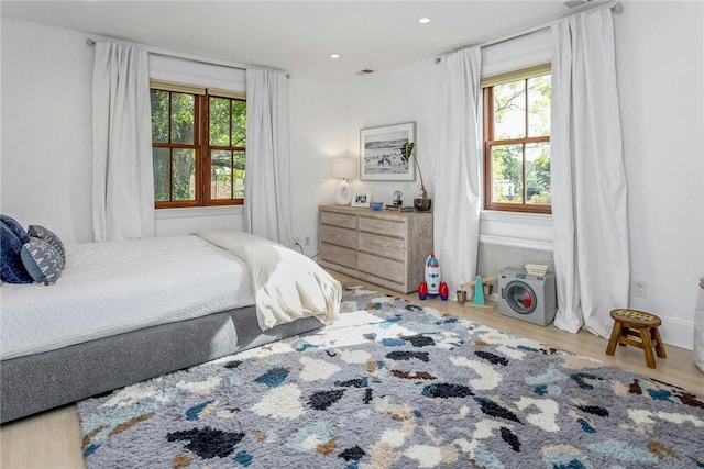 bedroom featuring wood finished floors and recessed lighting