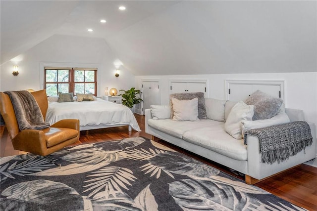 bedroom with lofted ceiling, wood finished floors, and recessed lighting