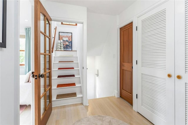 interior space featuring light wood-type flooring and french doors