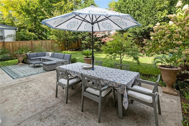 view of patio / terrace with outdoor dining space, outdoor lounge area, and fence