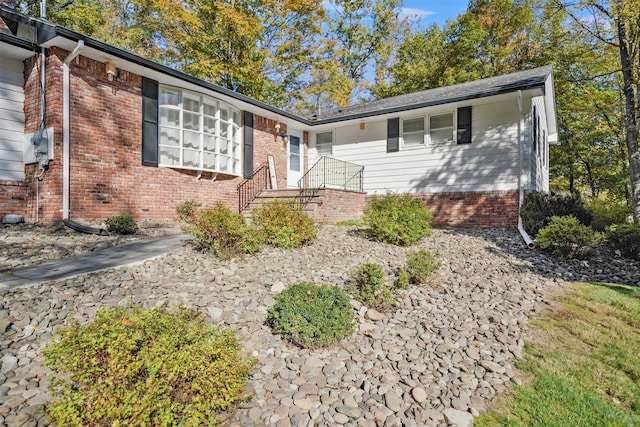 ranch-style home with brick siding