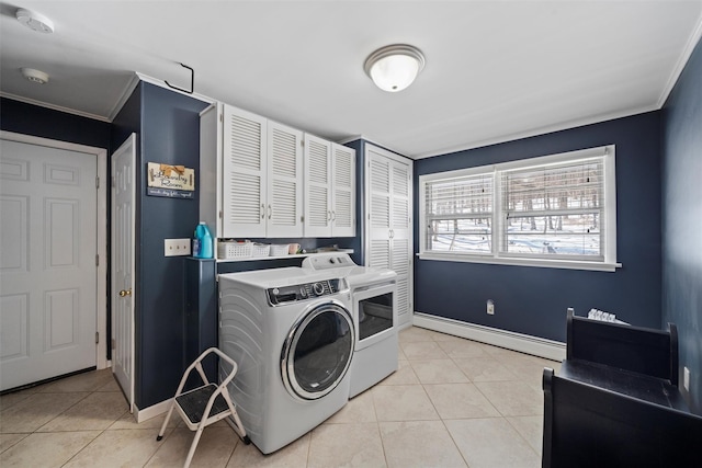 laundry room featuring a baseboard radiator, washing machine and dryer, light tile patterned flooring, and laundry area