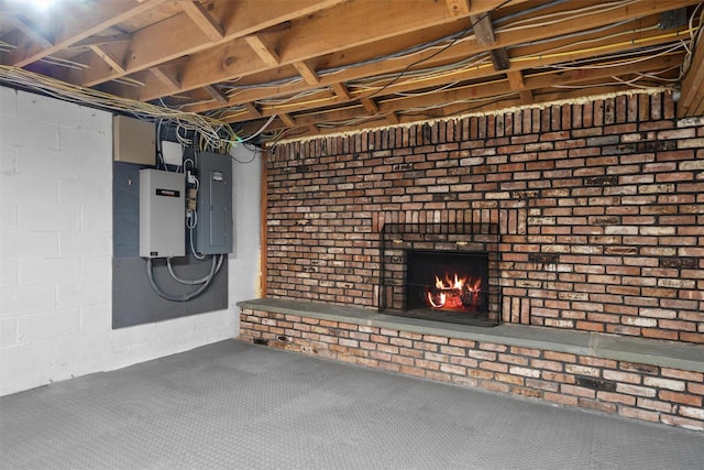 unfinished basement featuring carpet flooring, a brick fireplace, and electric panel