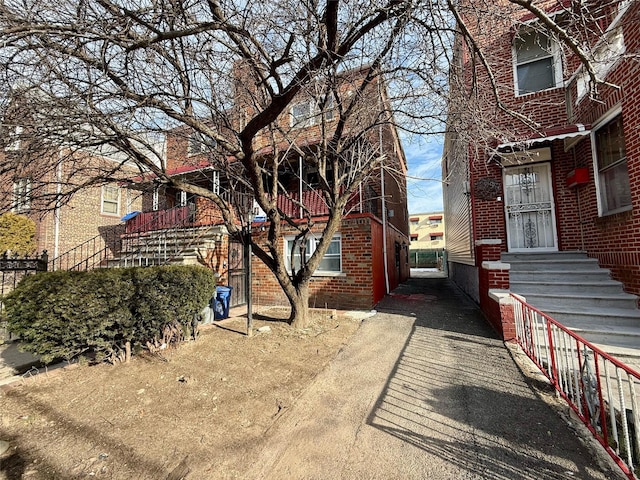 view of property exterior featuring brick siding