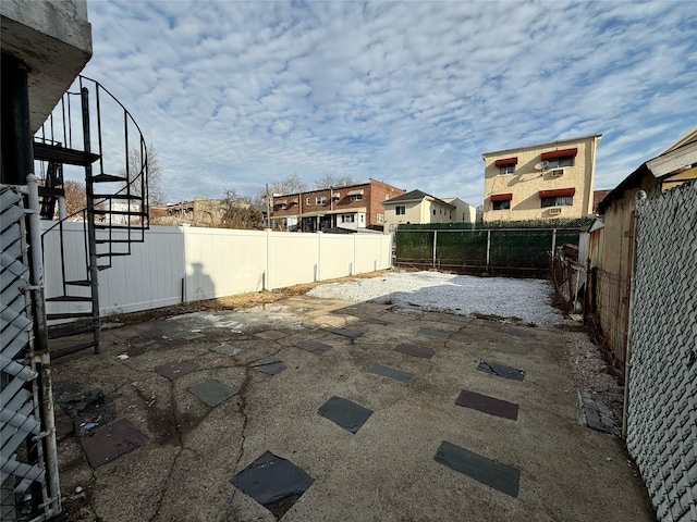 view of patio with a fenced backyard and a residential view