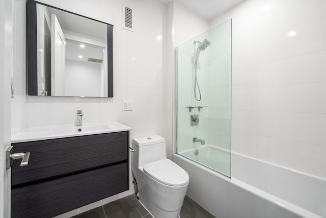 bathroom with toilet, shower / bath combination, and vanity