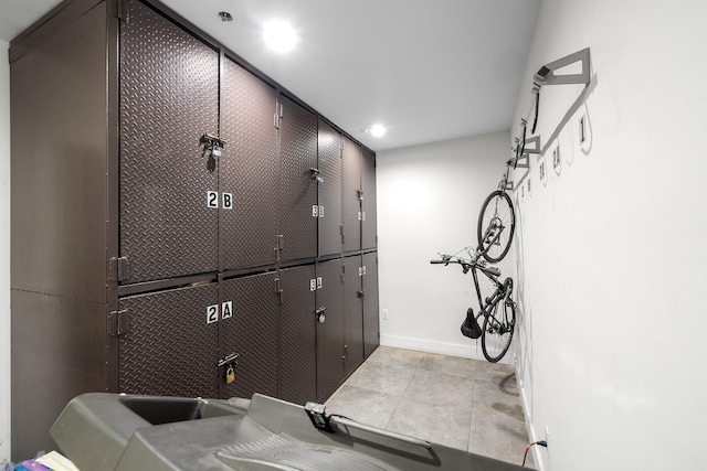 interior space featuring recessed lighting, tile patterned flooring, and baseboards