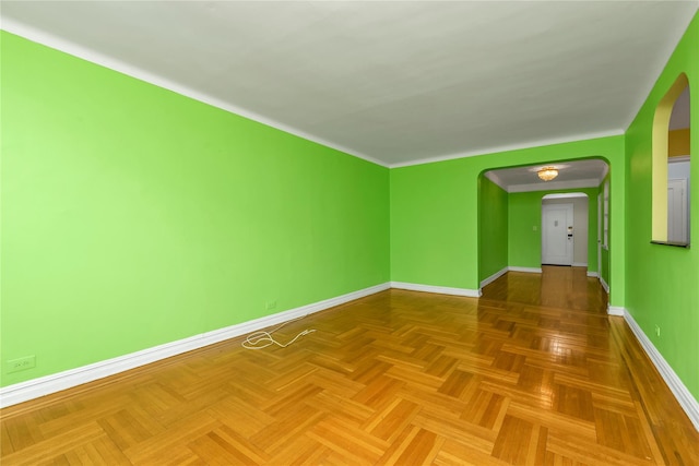 spare room with baseboards