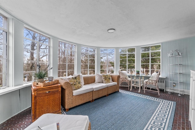 sunroom / solarium featuring radiator