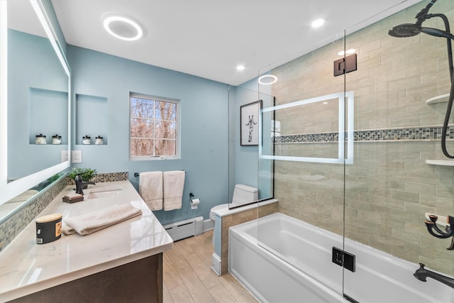 full bathroom featuring an enclosed shower, a sink, wood finished floors, baseboard heating, and a bath