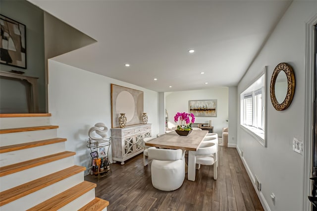 dining area with recessed lighting, dark wood-style flooring, stairway, and baseboards