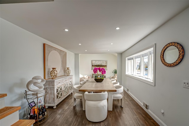 dining room with dark wood-style floors, visible vents, and recessed lighting