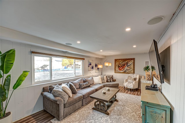 living area featuring wood finished floors and recessed lighting