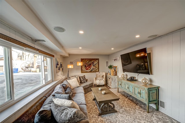 living area featuring recessed lighting and visible vents