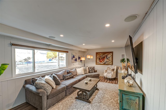 living area featuring wood finished floors and recessed lighting