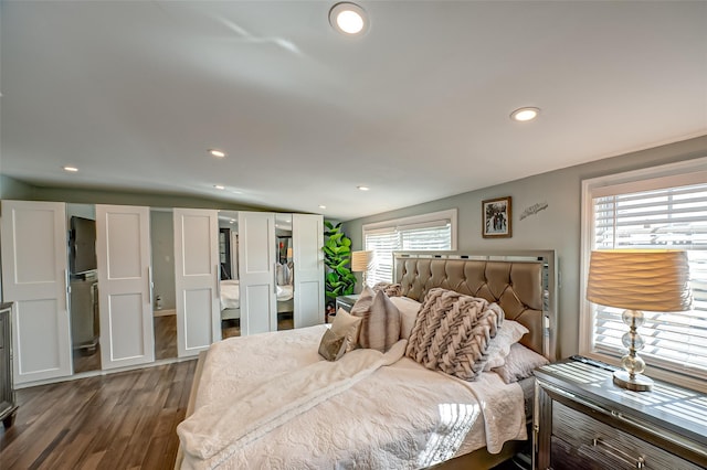 bedroom featuring dark wood-style floors and recessed lighting