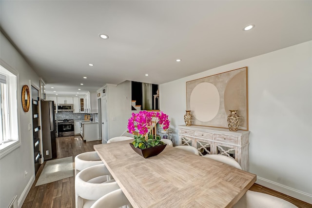 dining room with baseboards, dark wood-style flooring, visible vents, and recessed lighting