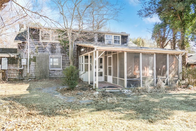 back of property featuring a sunroom