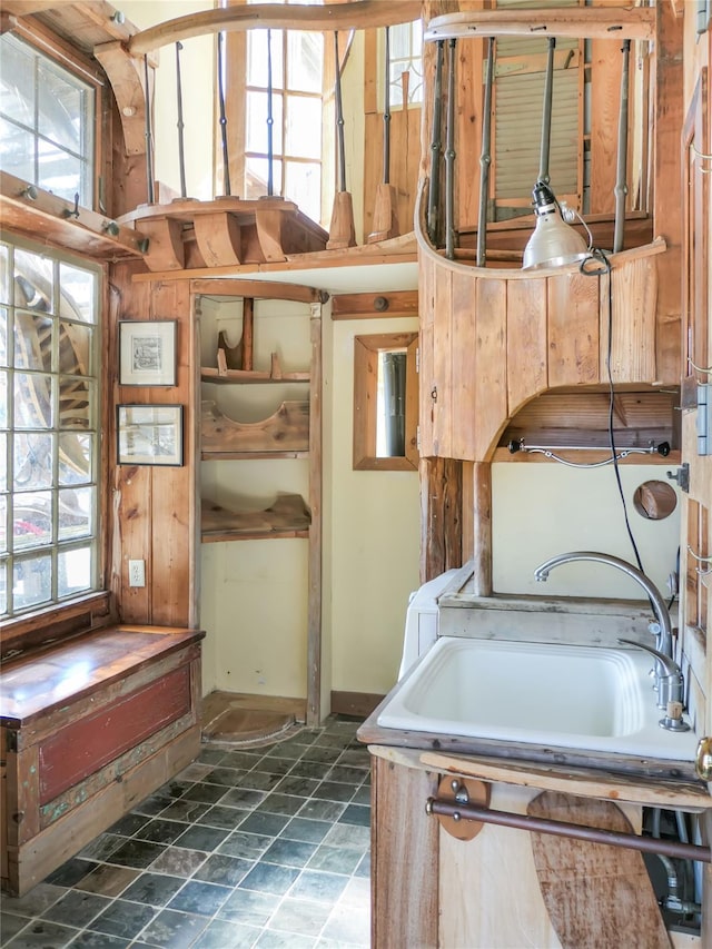 interior space featuring plenty of natural light and a sink