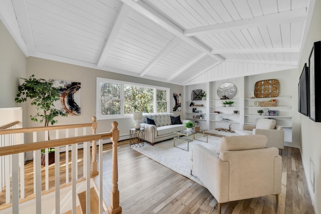 living room with lofted ceiling with beams, wood finished floors, and built in features