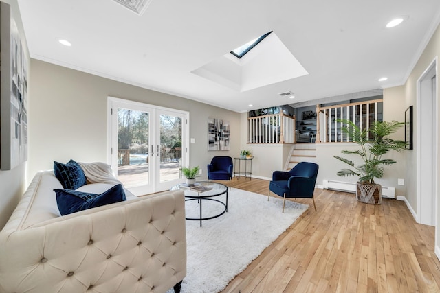 living area featuring light wood finished floors, baseboards, ornamental molding, french doors, and recessed lighting