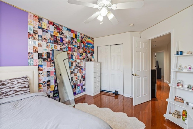 bedroom featuring baseboards, a closet, a ceiling fan, and wood finished floors