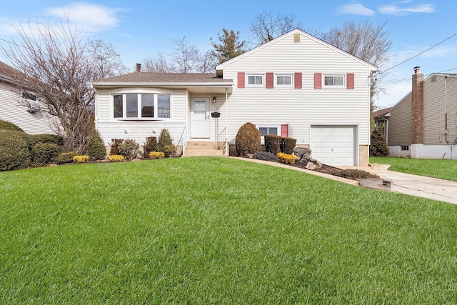 tri-level home featuring a garage, concrete driveway, and a front lawn