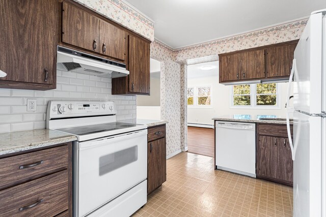 kitchen with under cabinet range hood, white appliances, dark brown cabinetry, and wallpapered walls