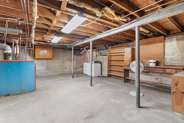 unfinished basement with separate washer and dryer