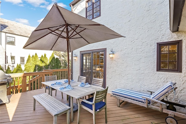 wooden deck with outdoor dining area