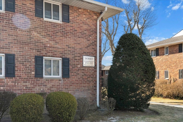 view of home's exterior featuring brick siding