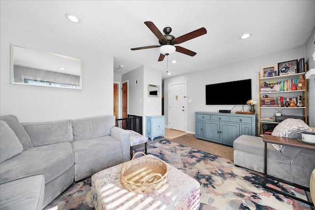 living area with recessed lighting, light carpet, and ceiling fan