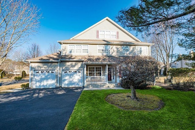 view of front of home with a garage, a porch, aphalt driveway, and a front yard