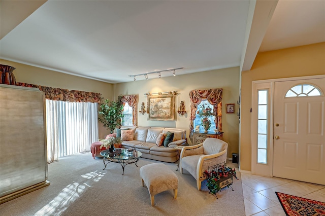 living room featuring light tile patterned floors and track lighting