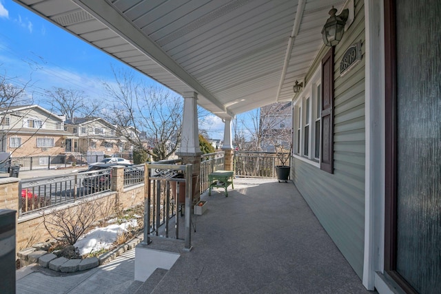 view of patio with covered porch and a residential view