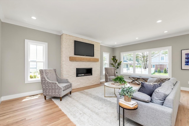 18 Anita Ave, Syosset, NY 11791 - living room featuring a fireplace, light wood-style floors, ornamental molding, and recessed lighting