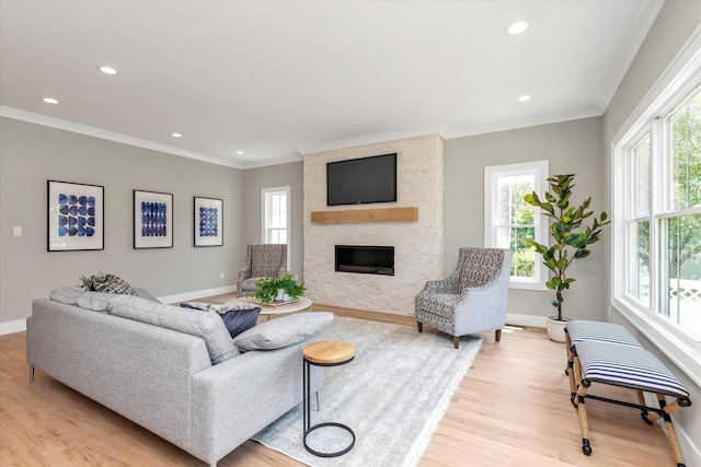 18 Anita Ave, Syosset, NY 11791 - living room featuring plenty of natural light, ornamental molding, a fireplace, light wood-style flooring, and recessed lighting