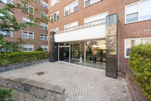 property entrance with brick siding