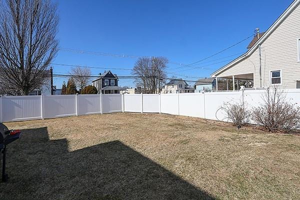 view of yard with a fenced backyard