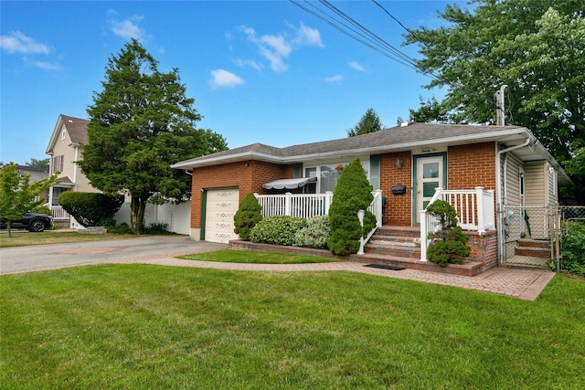 view of front of house featuring driveway, brick siding, a front lawn, and an attached garage