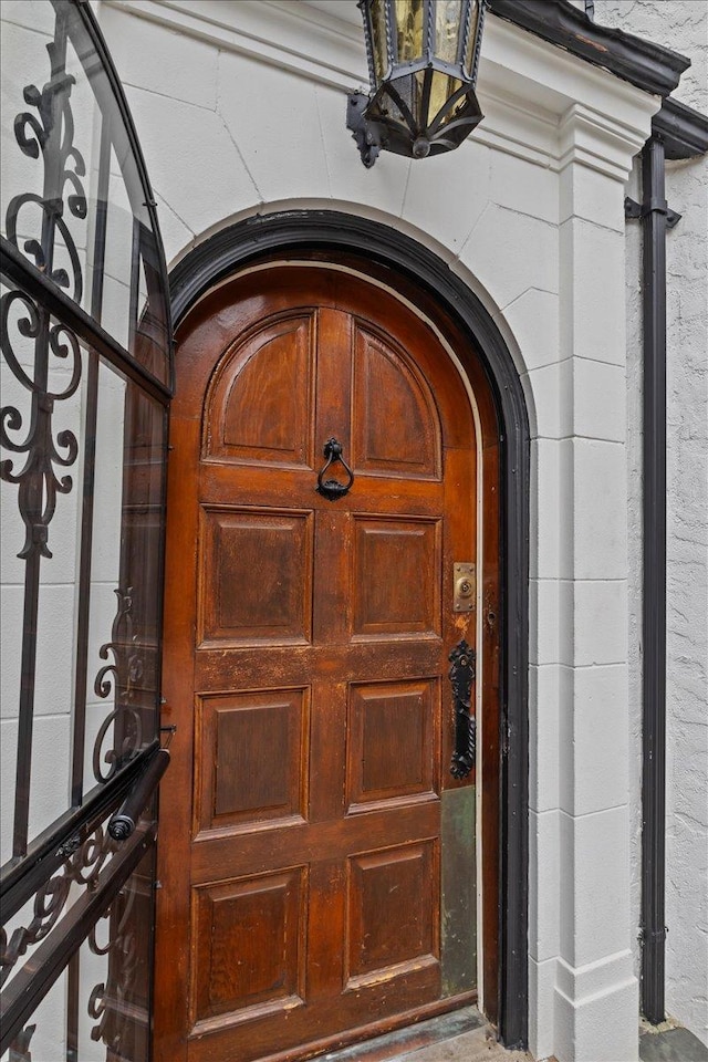 view of exterior entry featuring a garage