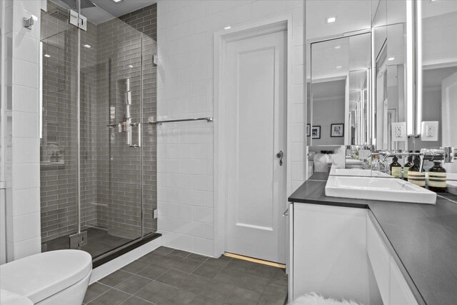 2737 Palisade Ave, Bronx, NY 10463 - full bathroom featuring a shower stall, vanity, tile patterned flooring, and toilet