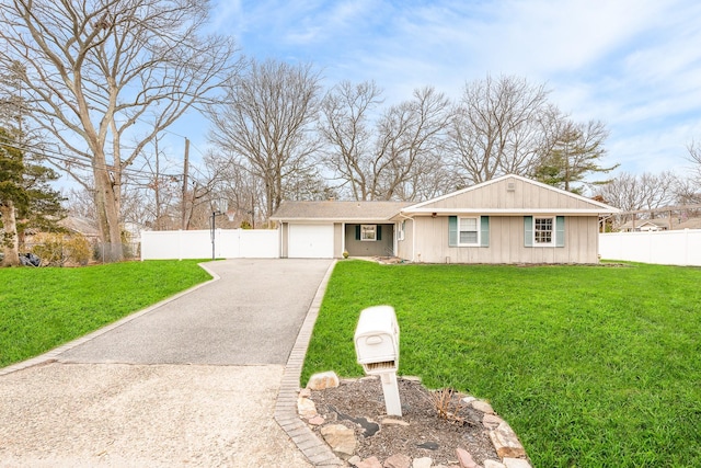 ranch-style house featuring aphalt driveway, an attached garage, fence, and a front yard