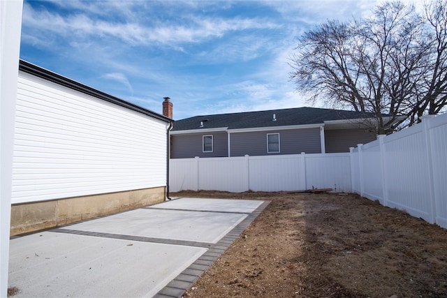 view of yard featuring a patio area and a fenced backyard