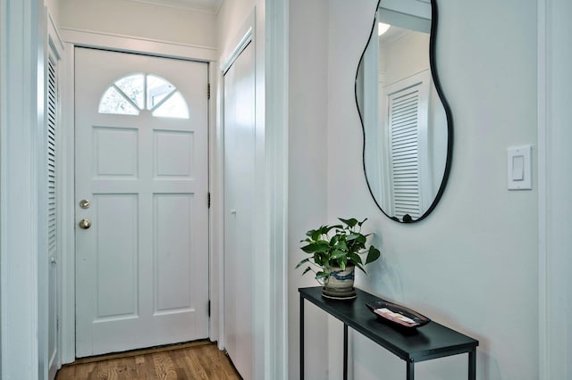 entryway with wood finished floors